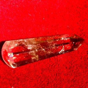 This is a clear quartz point.  It is 3 3/4” tall.